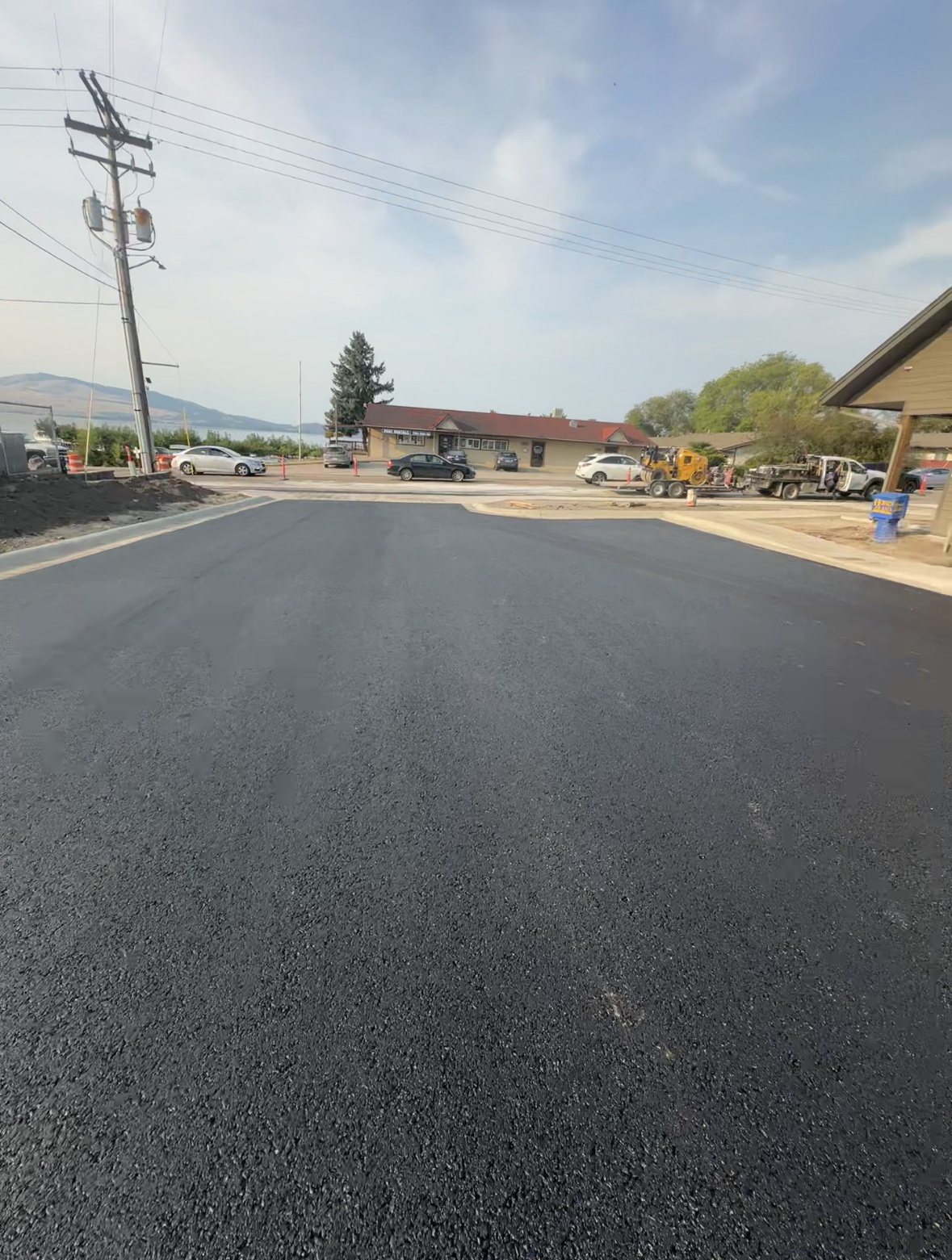 New asphalt surface at a commercial entrance